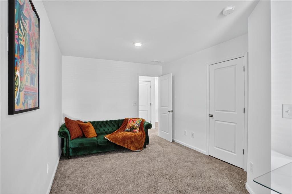 4125 Spring Valley Circle, Unit 7 Tucker, GA 30084 - Photo 12 of 20 a room with furniture and a lamp
