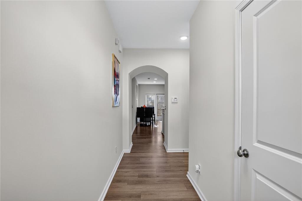 4125 Spring Valley Circle, Unit 7 Tucker, GA 30084 - Photo 14 of 20 a view of a hallway view with wooden floor and staircase