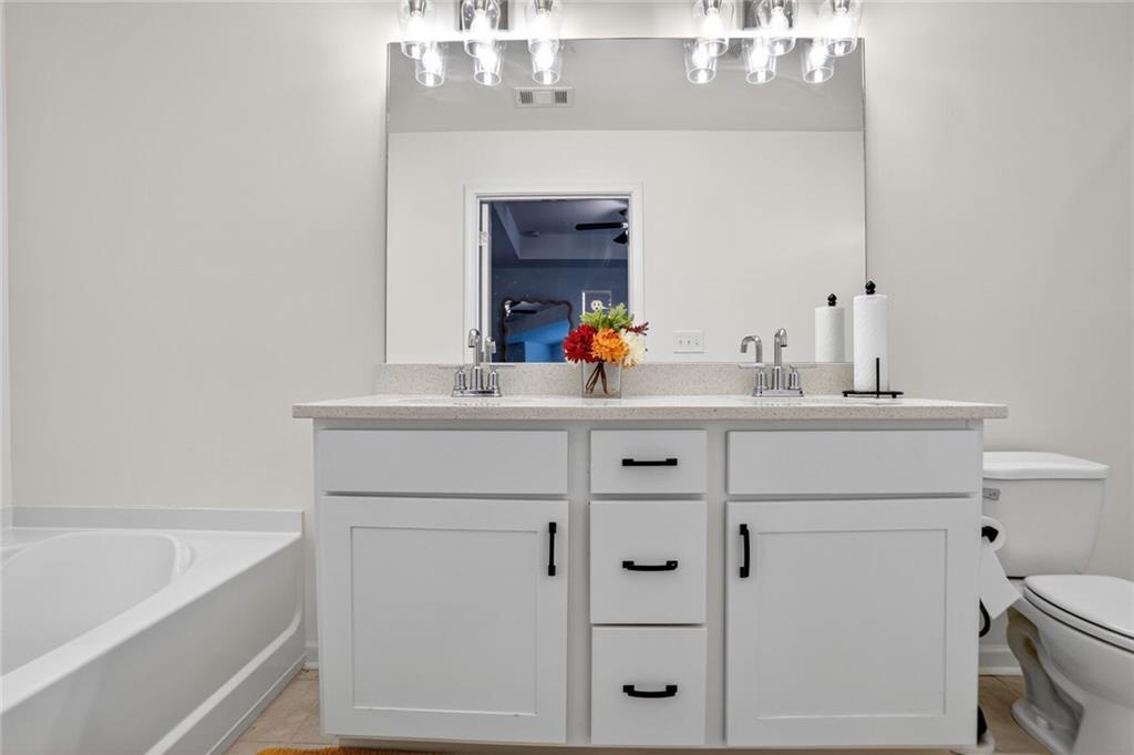 4125 Spring Valley Circle, Unit 7 Tucker, GA 30084 - Photo 15 of 20 a bathroom with a sink and a bathtub