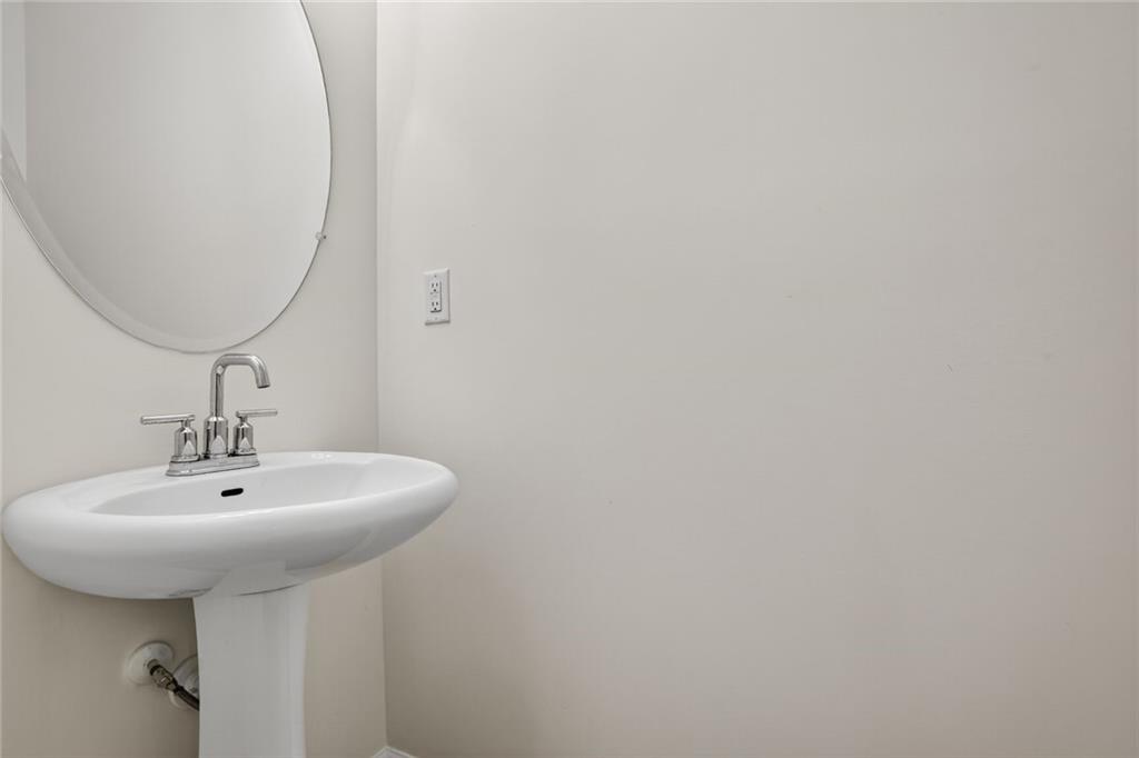 4125 Spring Valley Circle, Unit 7 Tucker, GA 30084 - Photo 18 of 20 a bathroom with a sink and a mirror