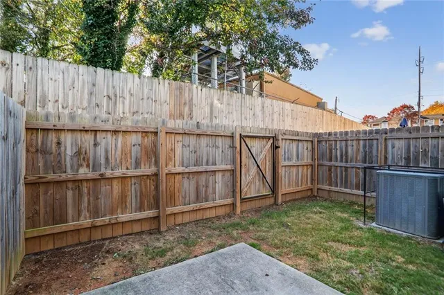 a view of outdoor space with wooden fence
