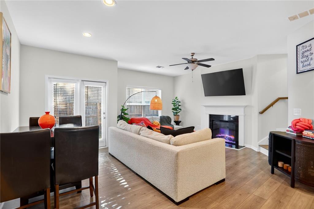 4125 Spring Valley Circle, Unit 7 Tucker, GA 30084 - Photo 3 of 20 a living room with furniture a fireplace and a flat screen tv