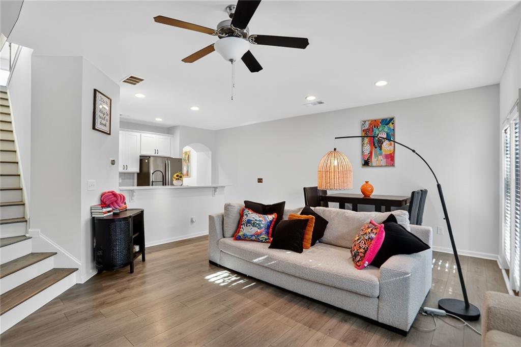 4125 Spring Valley Circle, Unit 7 Tucker, GA 30084 - Photo 5 of 20 a living room with furniture and kitchen view
