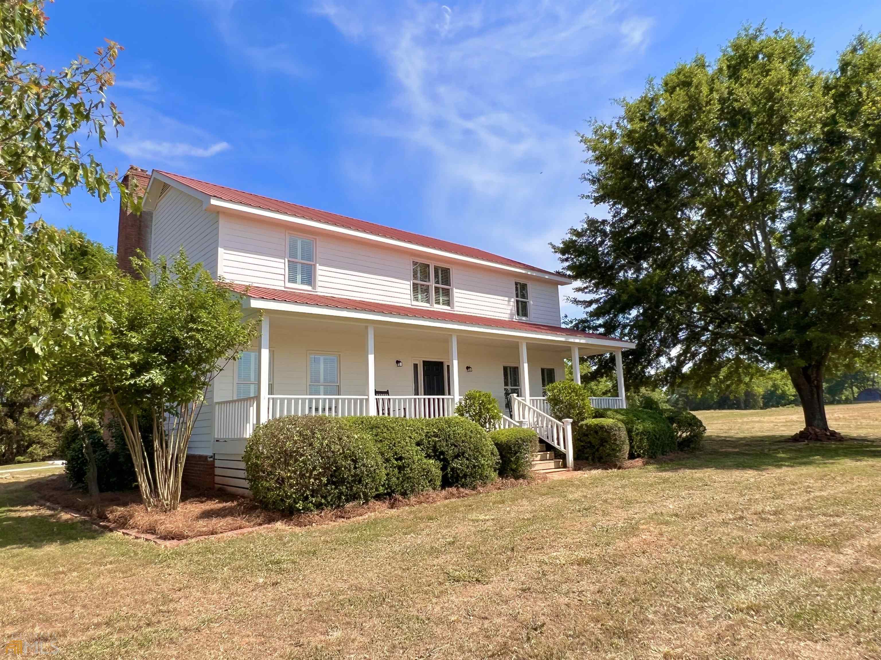 1501 High Shoals Road Bishop, GA 30621 - Photo 1 of 1 a front view of a house with a yard