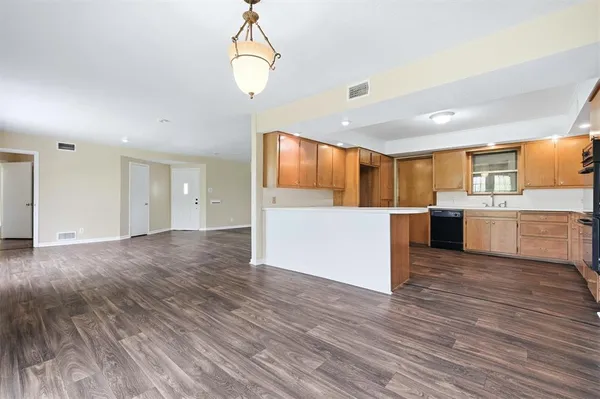 a view of kitchen with wooden floor