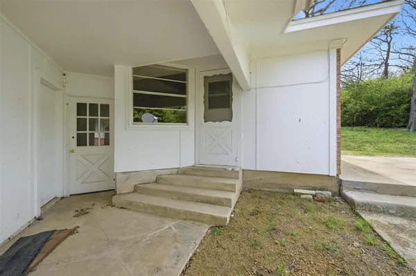 a view of a backyard of the house