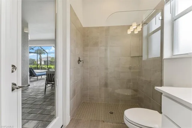 a bathroom with a toilet and shower