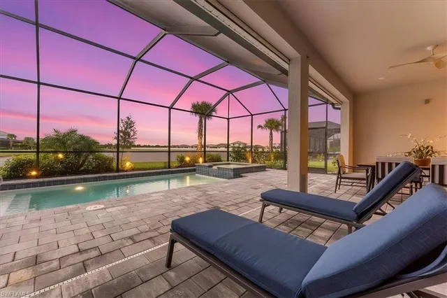 a view of swimming pool with outdoor seating