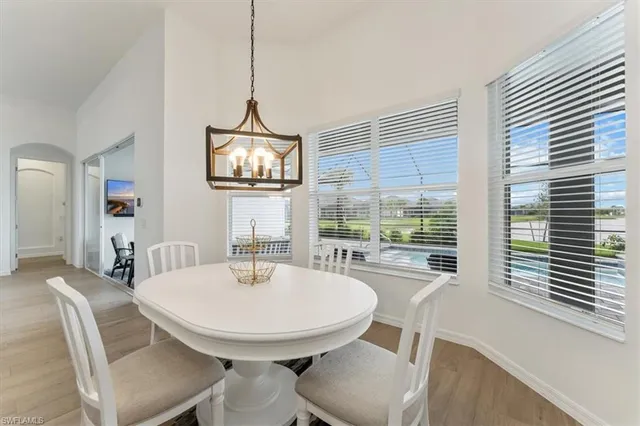 a view of a dining room with furniture window and outside view
