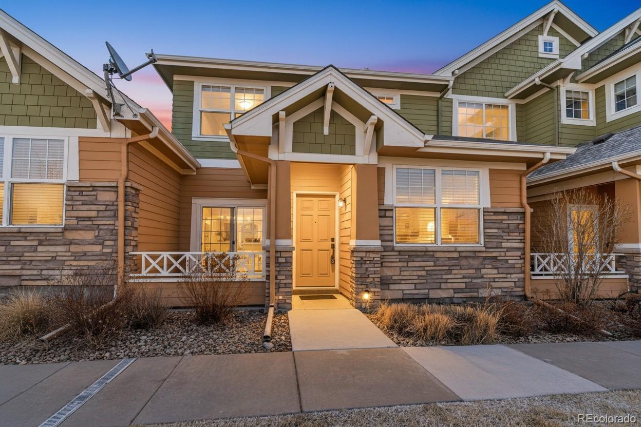 3672 South Perth Circle, Unit 105 Aurora, CO 80013 - Photo 15 of 19 a front view of a house with a yard