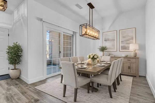 a view of a dining room with furniture window and wooden floor