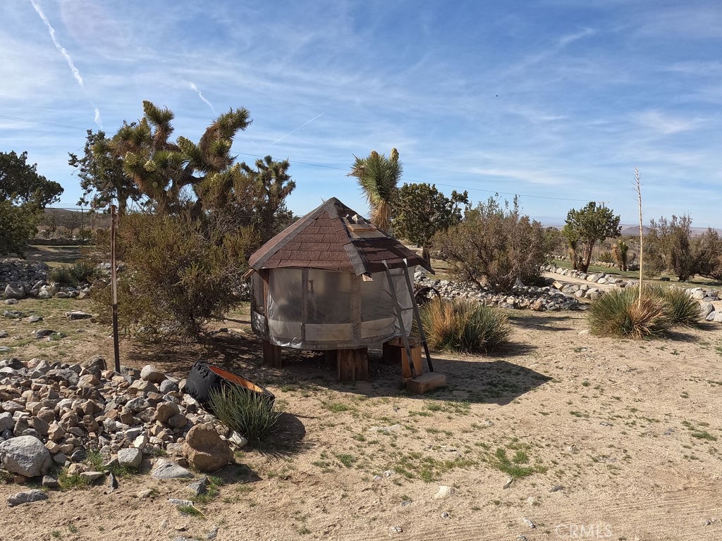 30000 Buchannon Ranch Road Llano, CA 93544 - Photo 17 of 64 a view of a house with a yard