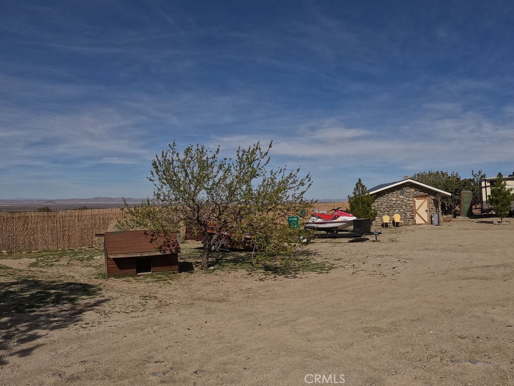 30000 Buchannon Ranch Road Llano, CA 93544 - Photo 20 of 67 a view of a car parked in front of a house