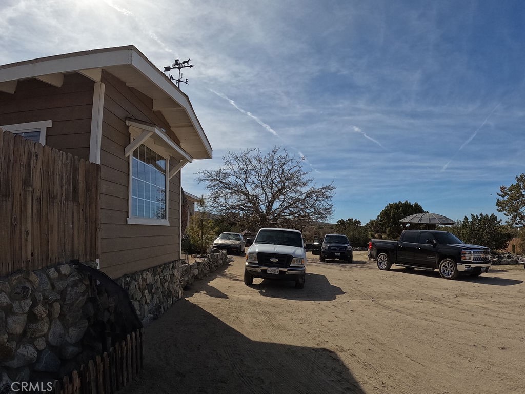 30000 Buchannon Ranch Road Llano, CA 93544 - Photo 34 of 67 a view of a car parked in front of a house