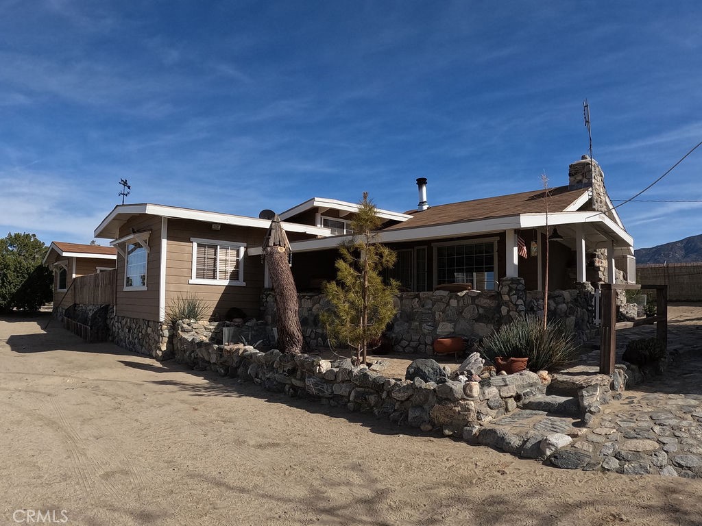 30000 Buchannon Ranch Road Llano, CA 93544 - Photo 47 of 64 a front view of a house with yard