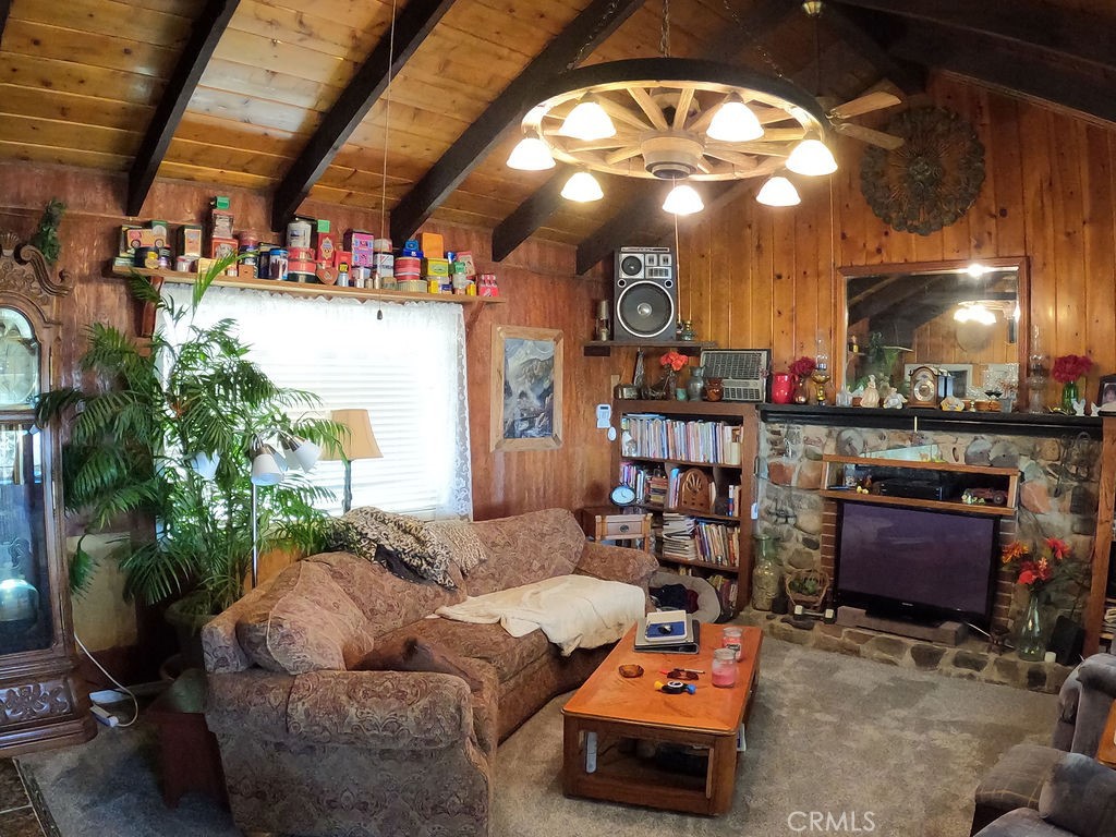 30000 Buchannon Ranch Road Llano, CA 93544 - Photo 52 of 67 a living room with lots of furniture and a chandelier