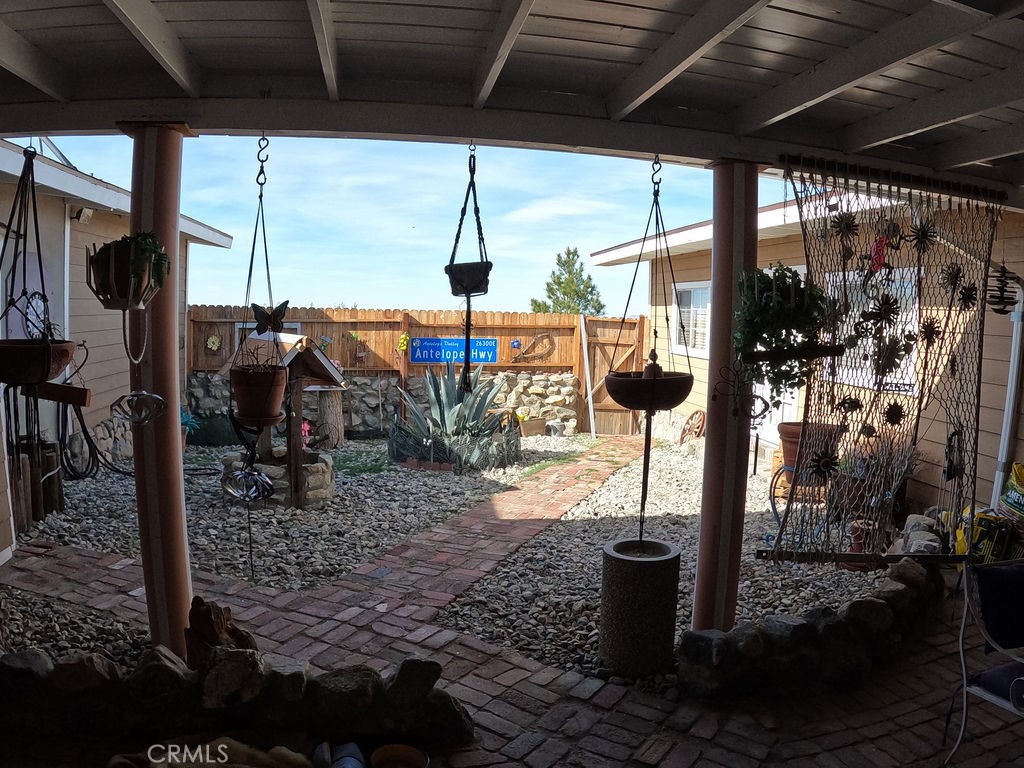 30000 Buchannon Ranch Road Llano, CA 93544 - Photo 63 of 67 a view of a porch with a potted plant