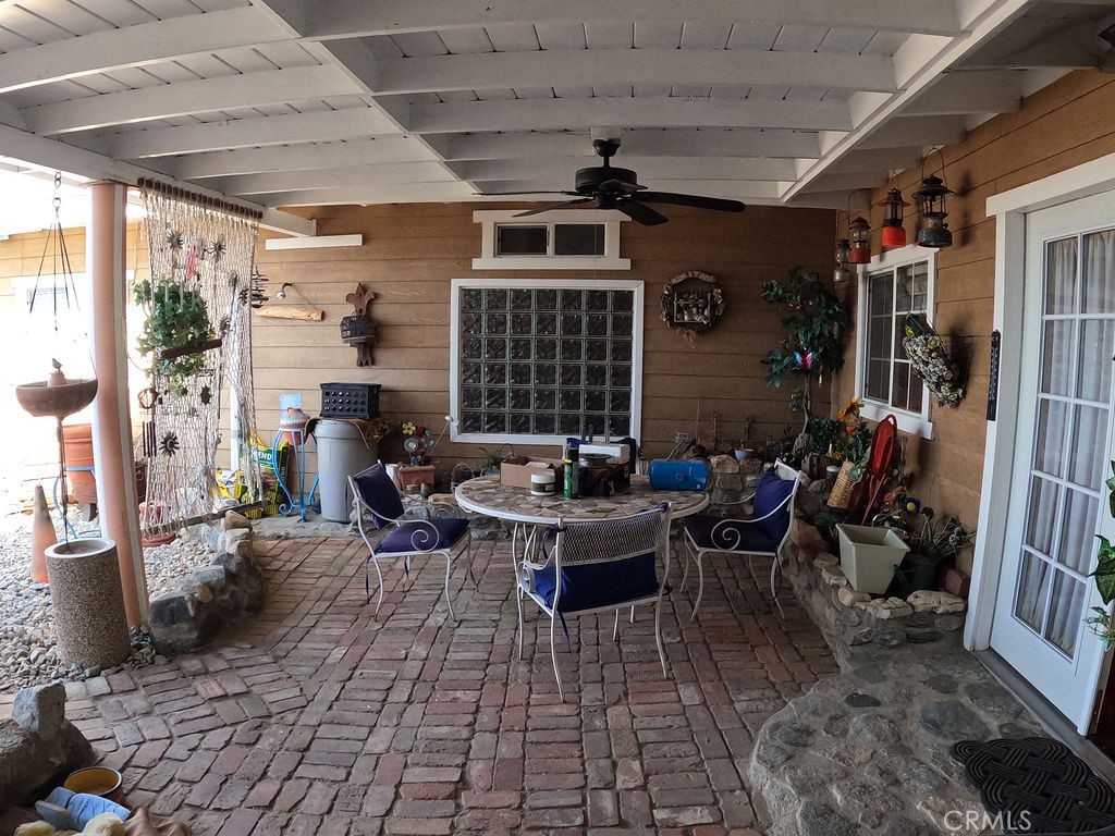 30000 Buchannon Ranch Road Llano, CA 93544 - Photo 64 of 67 a view of a porch with dining table and chairs