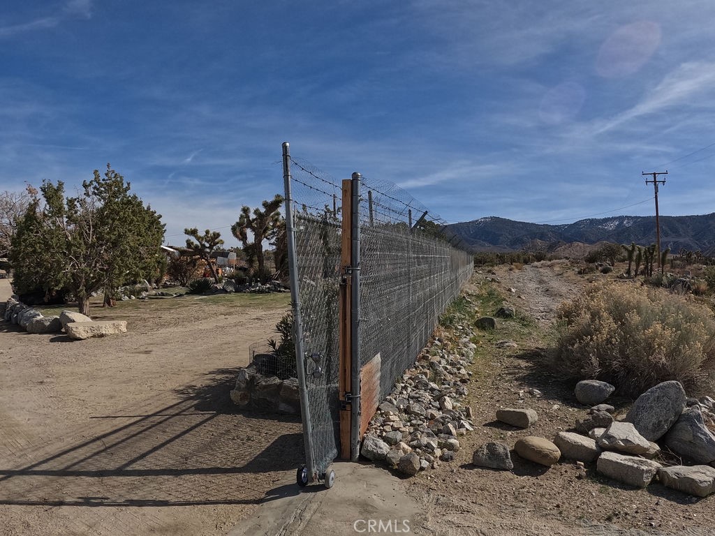 30000 Buchannon Ranch Road Llano, CA 93544 - Photo 8 of 67 a view of a terrace with a bench