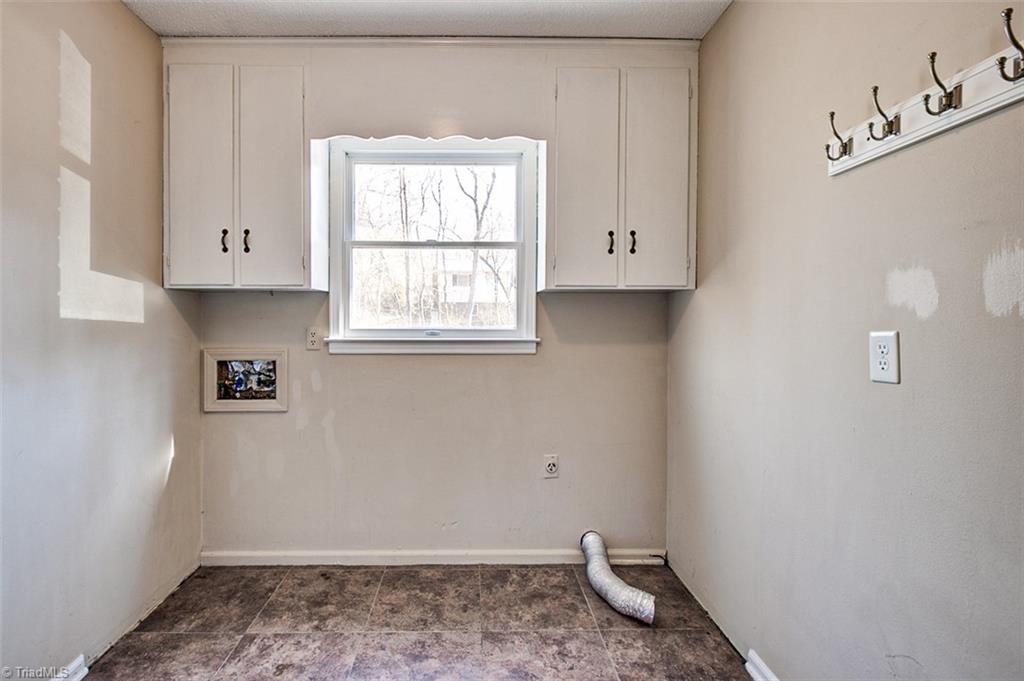 682 Inwood Road Asheboro, NC 27205 - Photo 11 of 40 Laundry room, storage cabinets