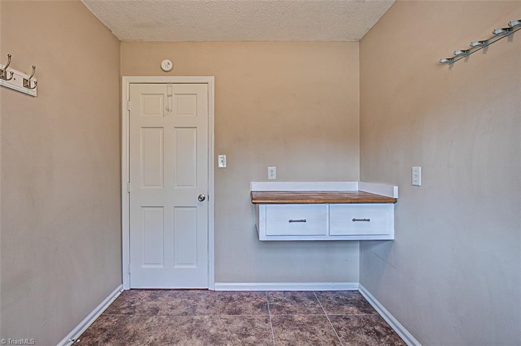 682 Inwood Road Asheboro, NC 27205 - Photo 12 of 40 Laundry room, folding table