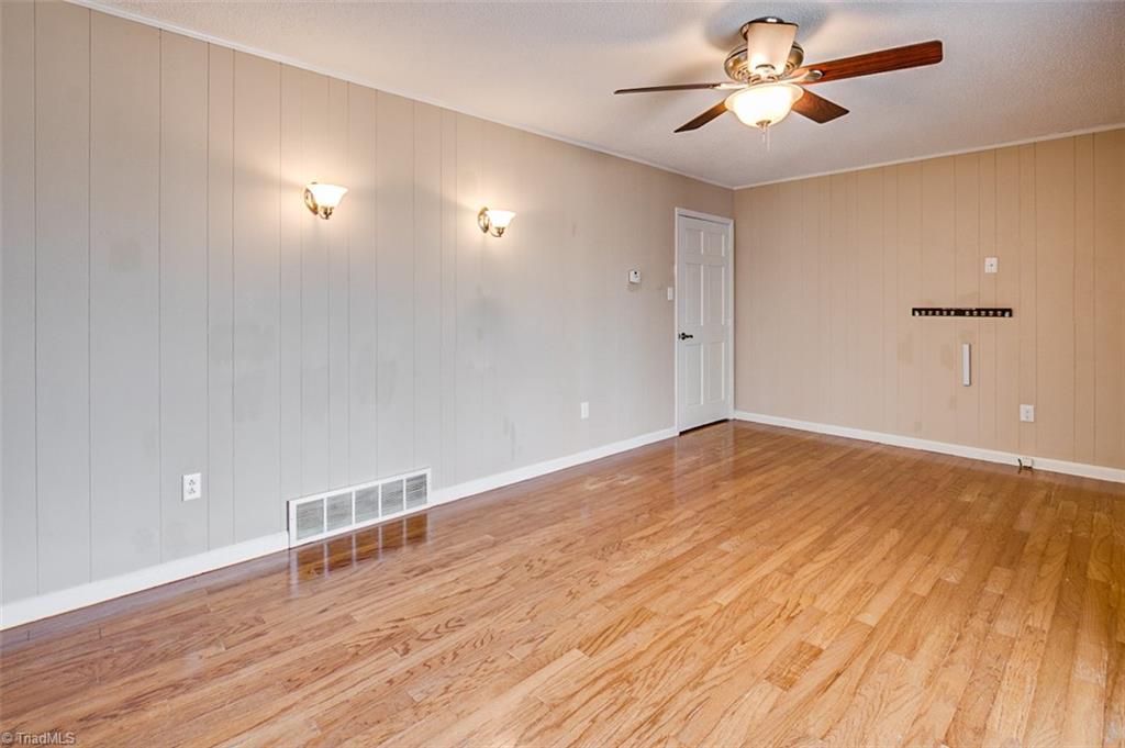 682 Inwood Road Asheboro, NC 27205 - Photo 15 of 40 Den, hardwood floors