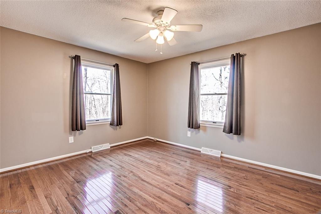 682 Inwood Road Asheboro, NC 27205 - Photo 16 of 40 Owner's bedroom, hardwood floors