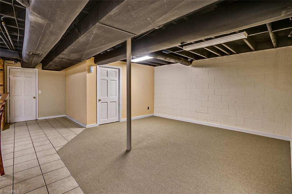 682 Inwood Road Asheboro, NC 27205 - Photo 25 of 40 Semi-finished basement Den area (not included in sq footage)
