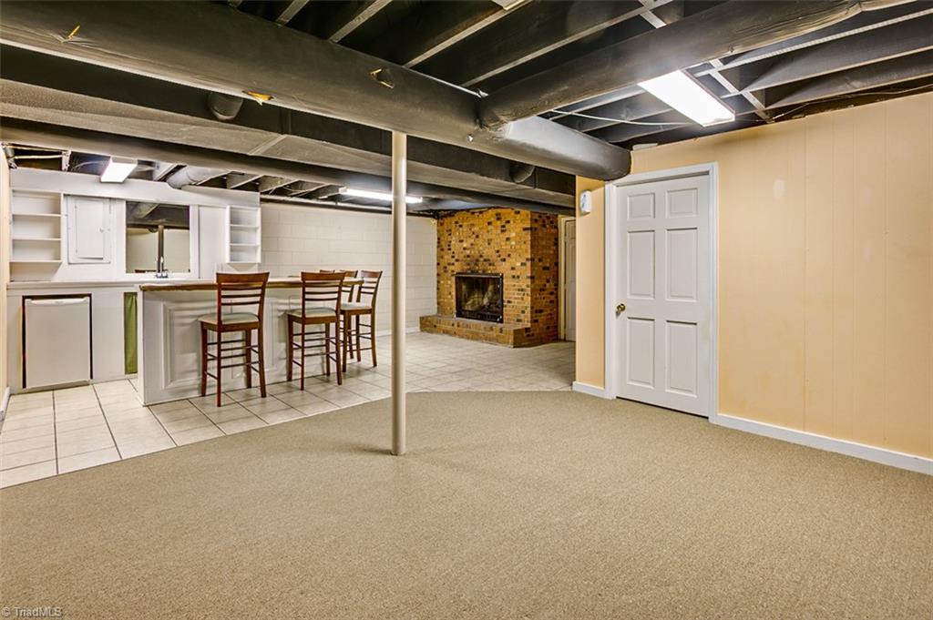 682 Inwood Road Asheboro, NC 27205 - Photo 26 of 40 Semi-finished basement den area looking into the kitchen (not included in sq footage)