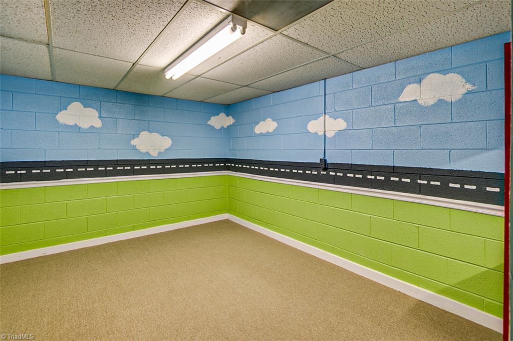 682 Inwood Road Asheboro, NC 27205 - Photo 29 of 40 Semi-finished basement Playroom (not included in sq footage)