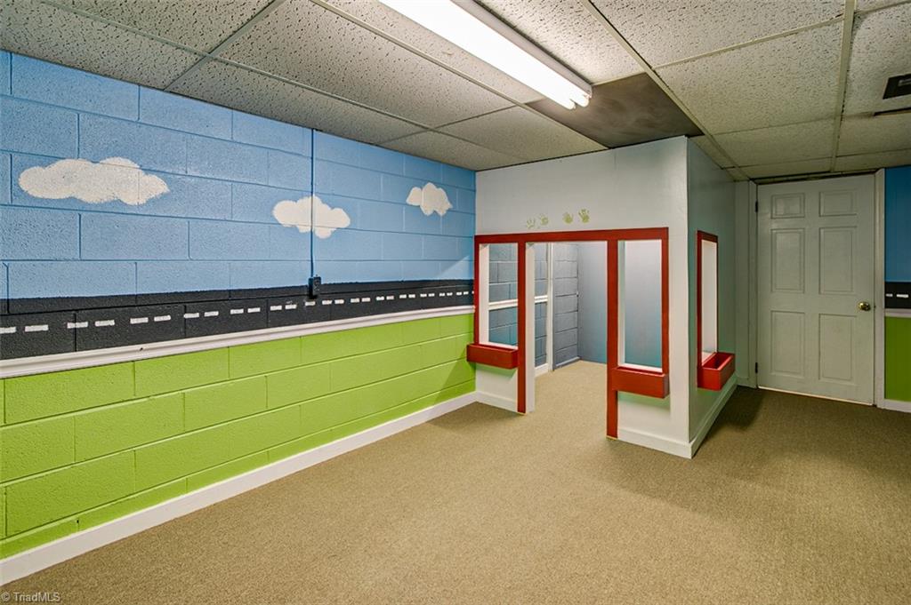 682 Inwood Road Asheboro, NC 27205 - Photo 30 of 40 Semi-finished basement Playroom (not included in sq footage)