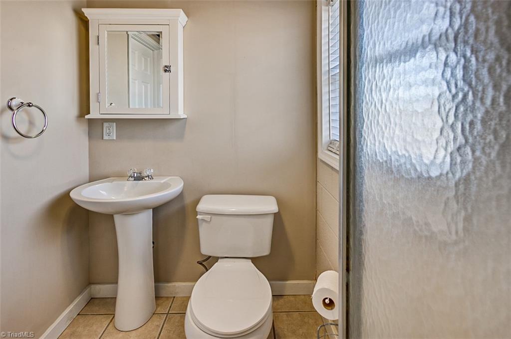 682 Inwood Road Asheboro, NC 27205 - Photo 32 of 40 Semi-finished basement Full bath, ceramic floor (not included in sq footage)