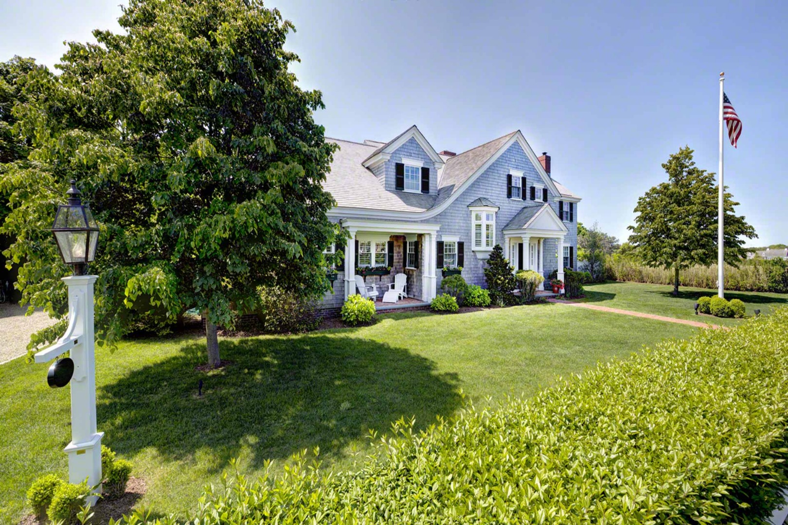 1 Field Club Drive Edgartown, MA 02539 - Photo 3 of 24 a front view of a house with a yard