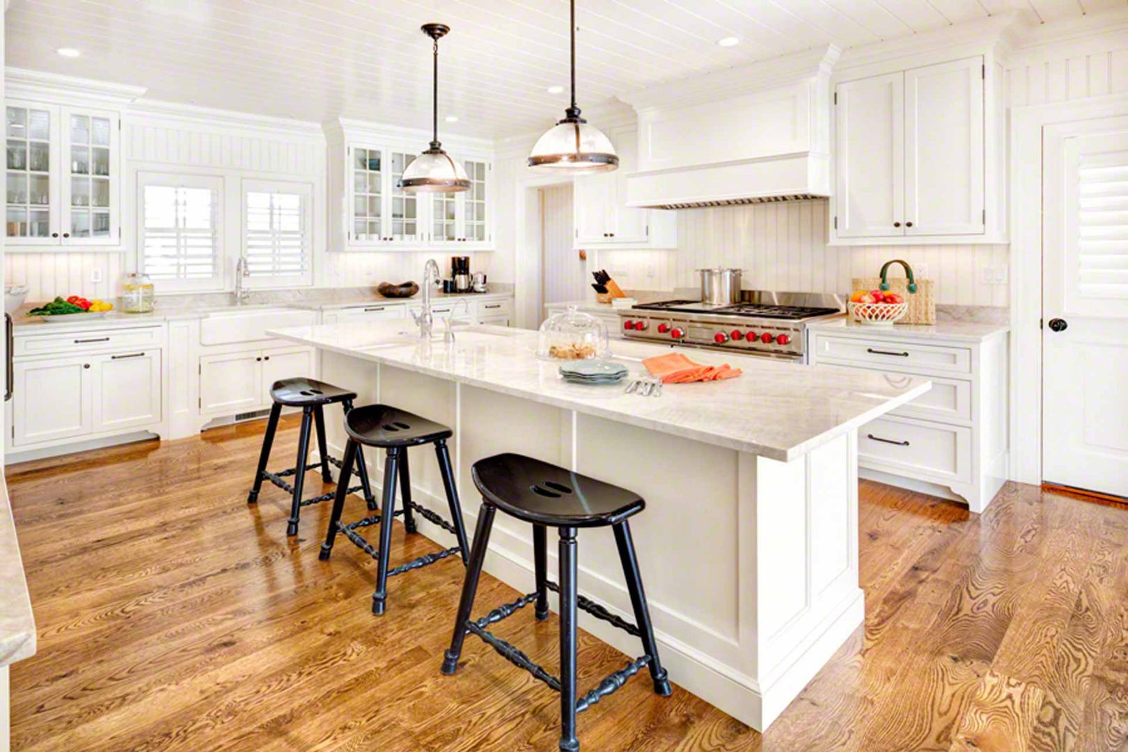 1 Field Club Drive Edgartown, MA 02539 - Photo 10 of 24 a kitchen with stainless steel appliances kitchen island granite countertop a stove a sink and a refrigerator