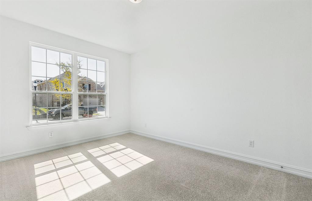 14550 Jemison Street Pilot Point, TX 76258 - Photo 13 of 23 Bright and airy secondary bedroom