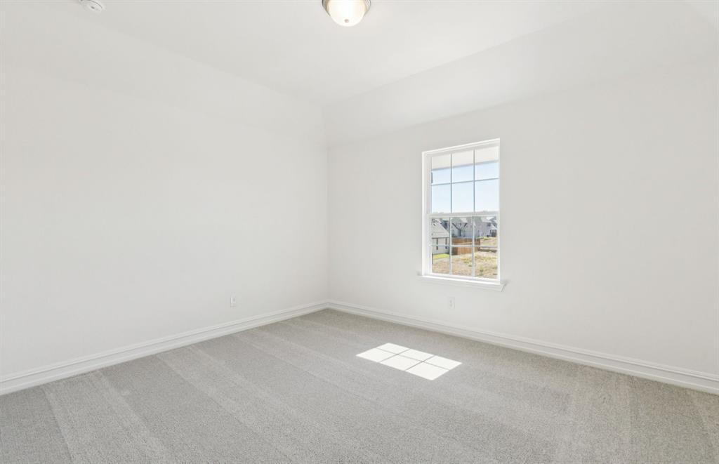 14550 Jemison Street Pilot Point, TX 76258 - Photo 19 of 23 Secondary bedroom designed for comfort and convenience