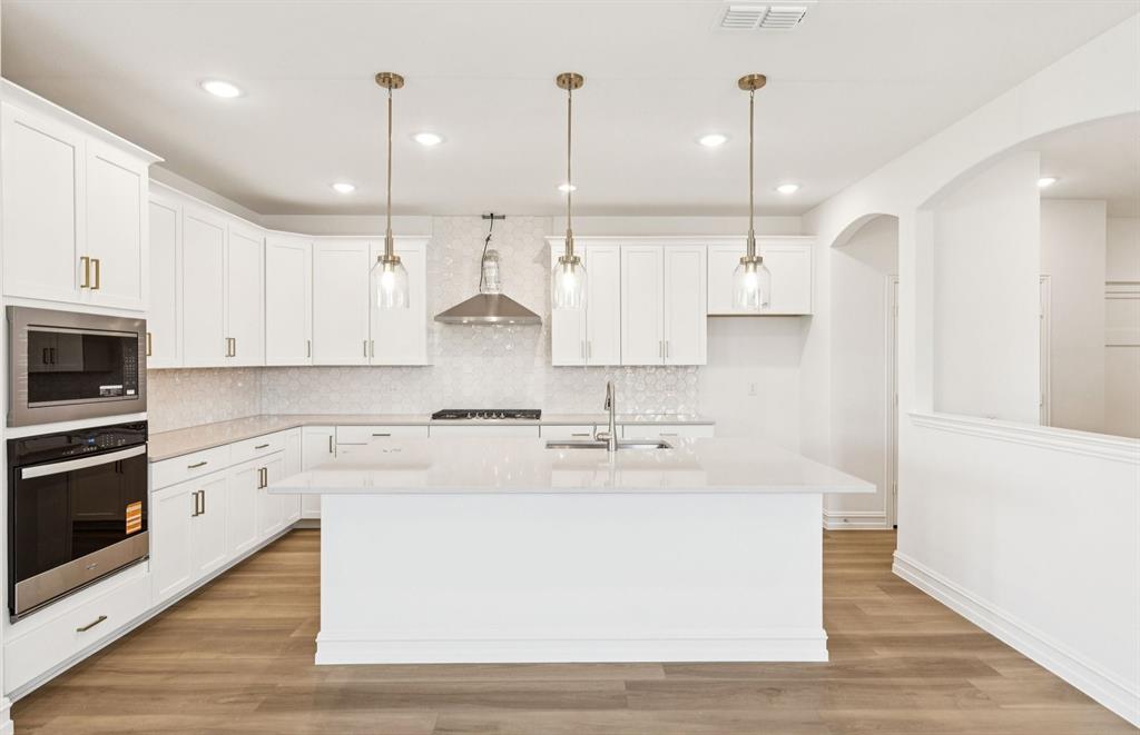 14550 Jemison Street Pilot Point, TX 76258 - Photo 3 of 23 Bright kitchen with an expansive center island perfect for gatherings