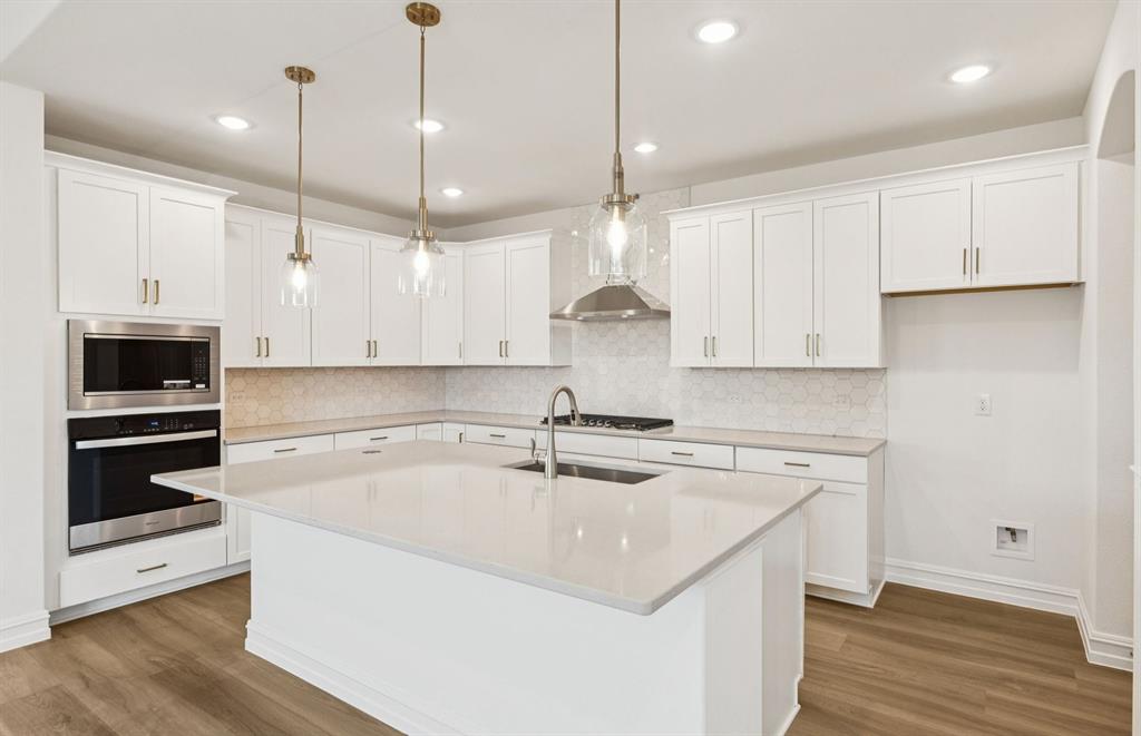 14550 Jemison Street Pilot Point, TX 76258 - Photo 4 of 23 Large island overlooking gathering room and dining areas