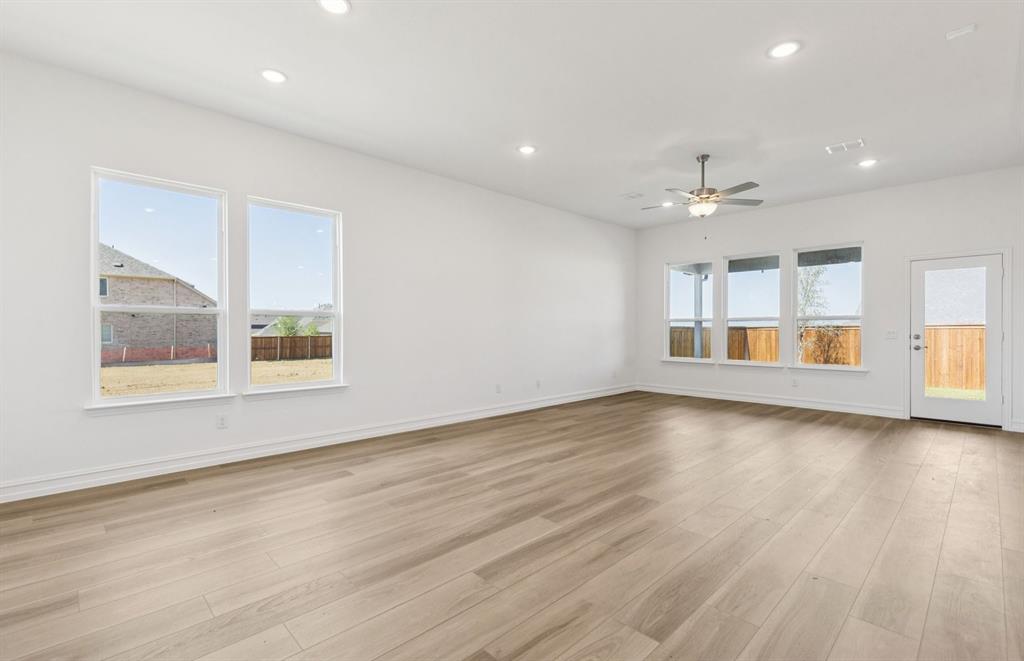 14550 Jemison Street Pilot Point, TX 76258 - Photo 6 of 23 Spacious gathering room with large windows