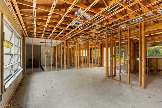 a view of an empty room with glass door