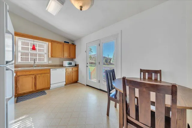 a kitchen with a refrigerator and a stove
