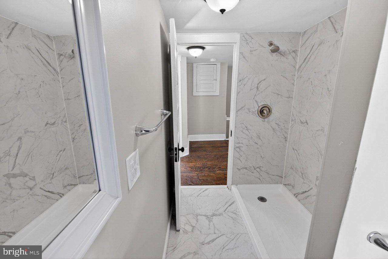 26 Olive Street Salem, NJ 08079 - Photo 12 of 33 a bathroom with a shower and a tub