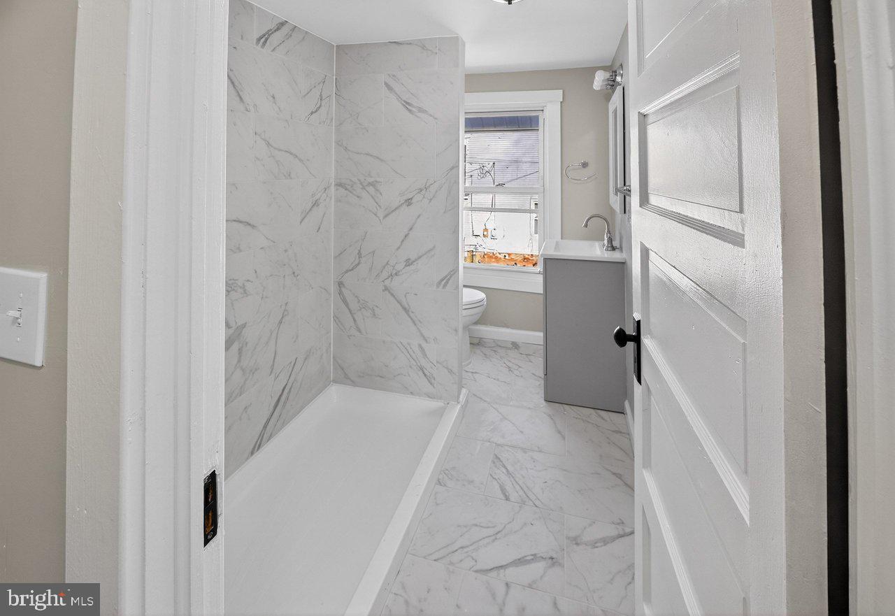 26 Olive Street Salem, NJ 08079 - Photo 13 of 33 a bathroom with a bathtub and shower