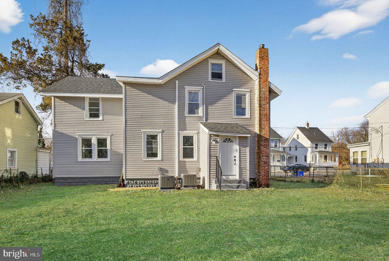 26 Olive Street Salem, NJ 08079 - Photo 31 of 33 a front view of a house with a garden
