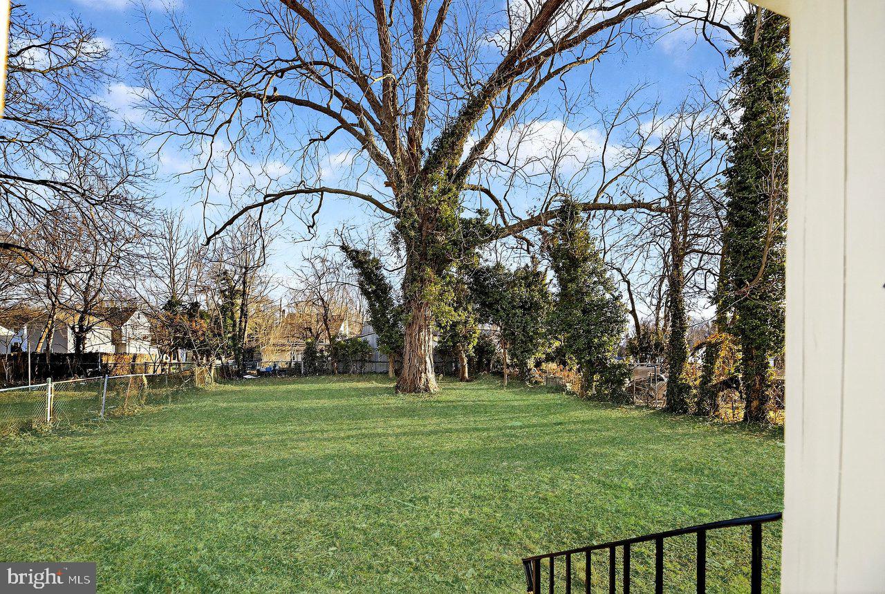 26 Olive Street Salem, NJ 08079 - Photo 33 of 33 a backyard of a house with lots of green space and fountain