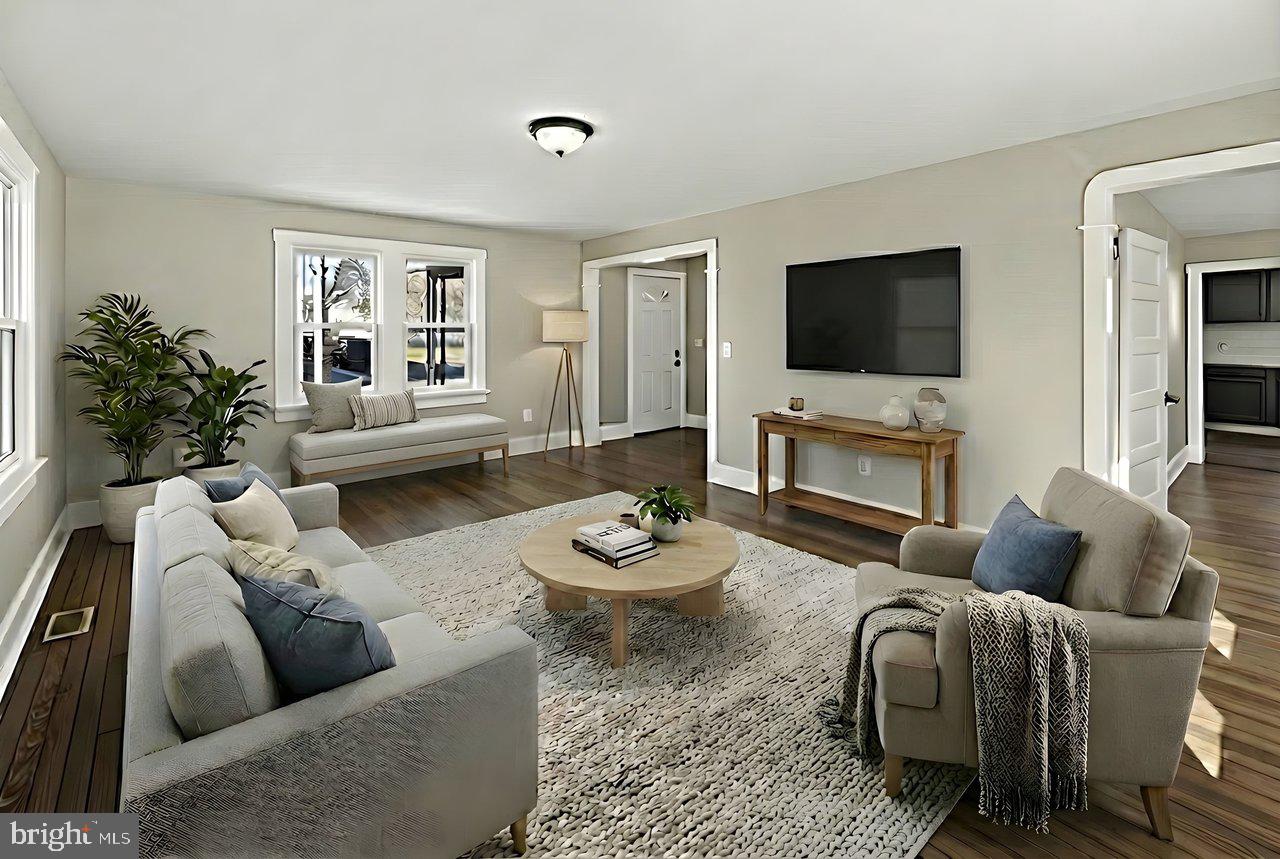 26 Olive Street Salem, NJ 08079 - Photo 4 of 33 a living room with furniture and a flat screen tv