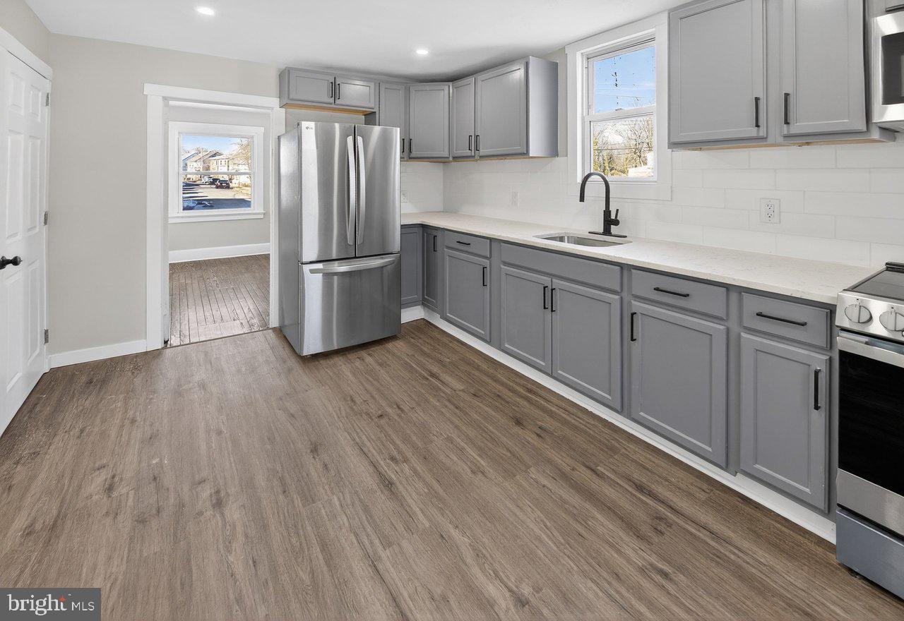 26 Olive Street Salem, NJ 08079 - Photo 5 of 33 a kitchen with stainless steel appliances granite countertop a refrigerator sink and cabinets