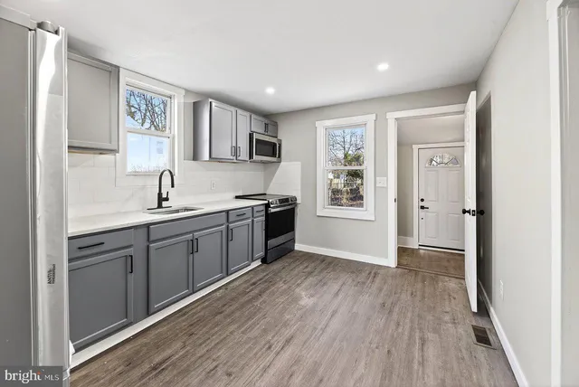 a bathroom with a bathtub and shower