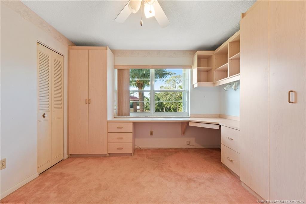 1907 Southwest Palm City Road, Unit 4J Stuart, FL 34994 - Photo 16 of 34 a room with window and cabinet