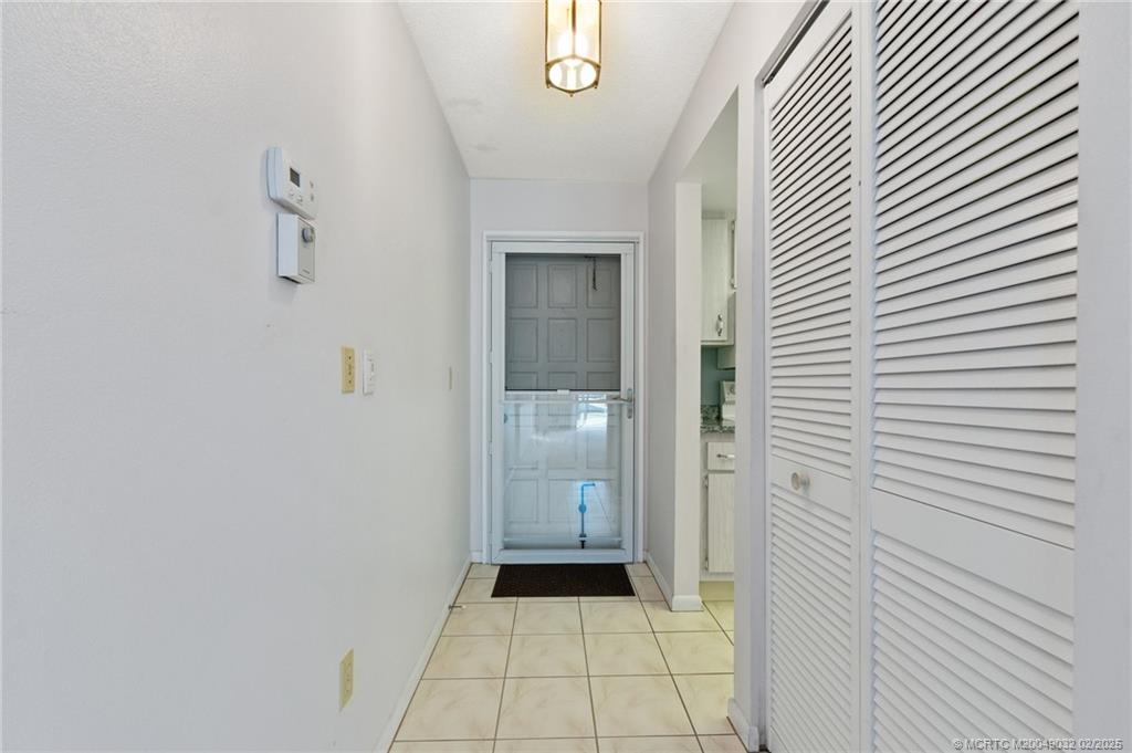 1907 Southwest Palm City Road, Unit 4J Stuart, FL 34994 - Photo 4 of 34 a view of a hallway